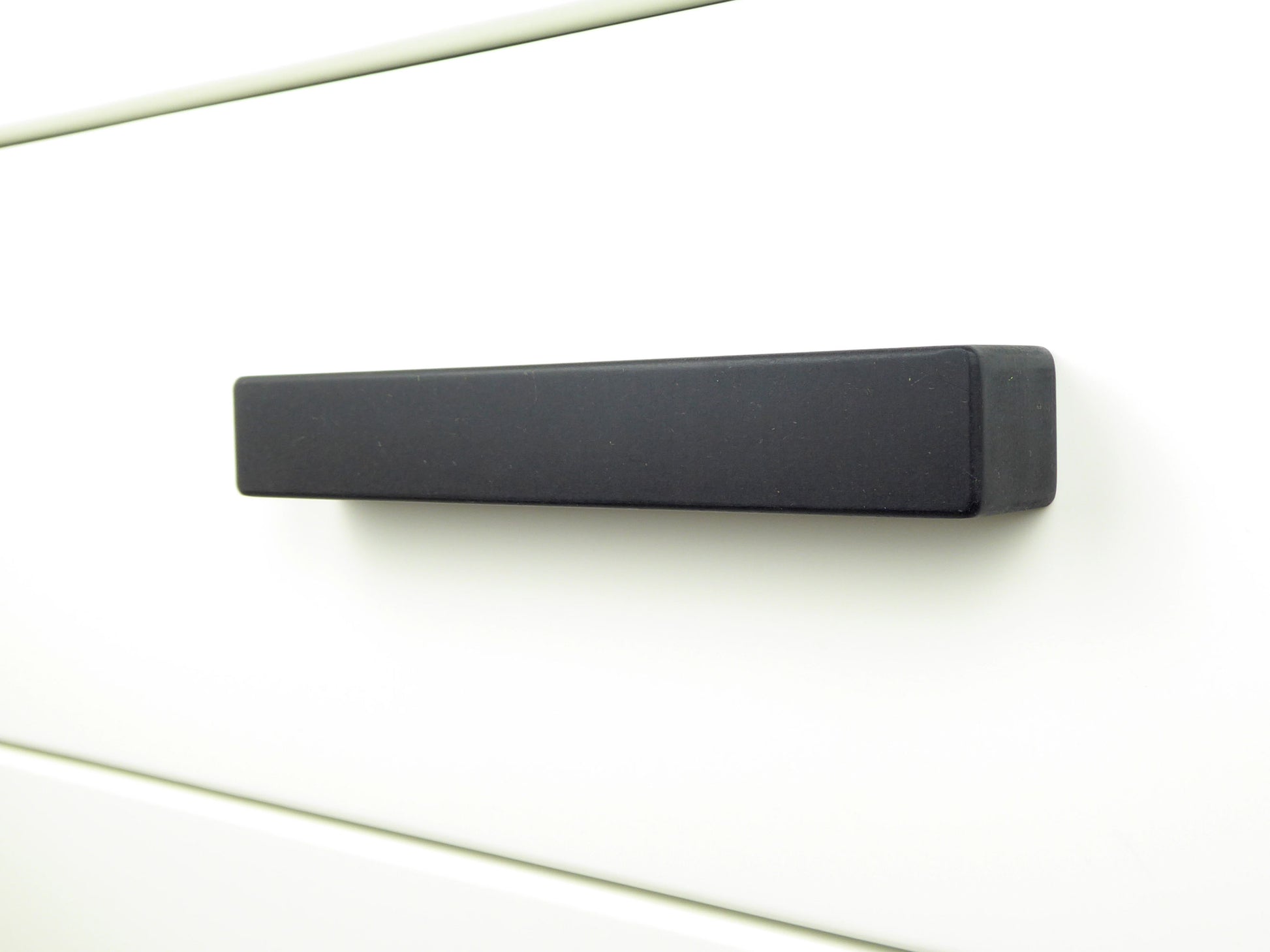 Sleek wooden kitchen cabinet handle