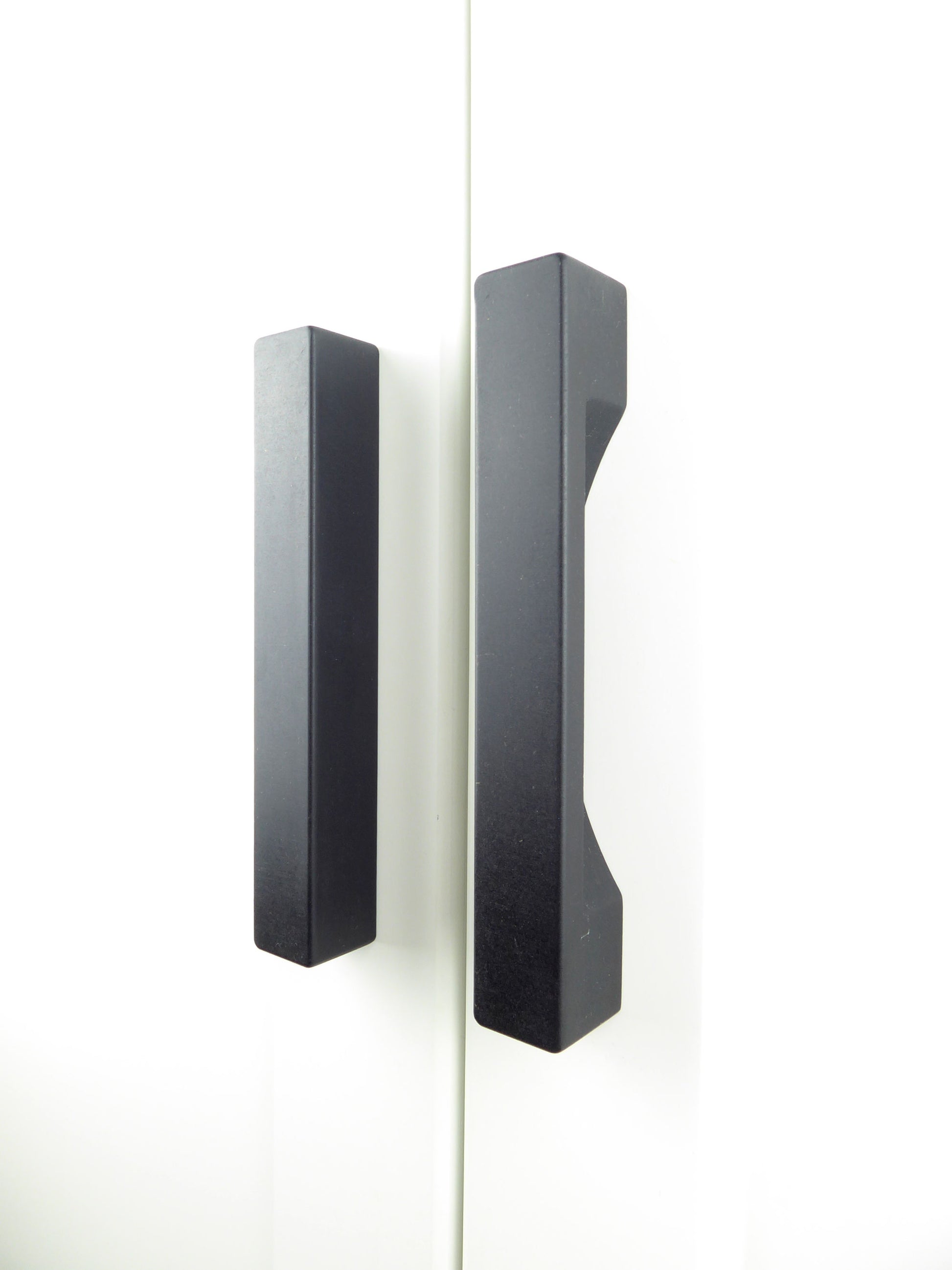 Chunky custom wardrobe handles handcrafted from black Valchromat wood