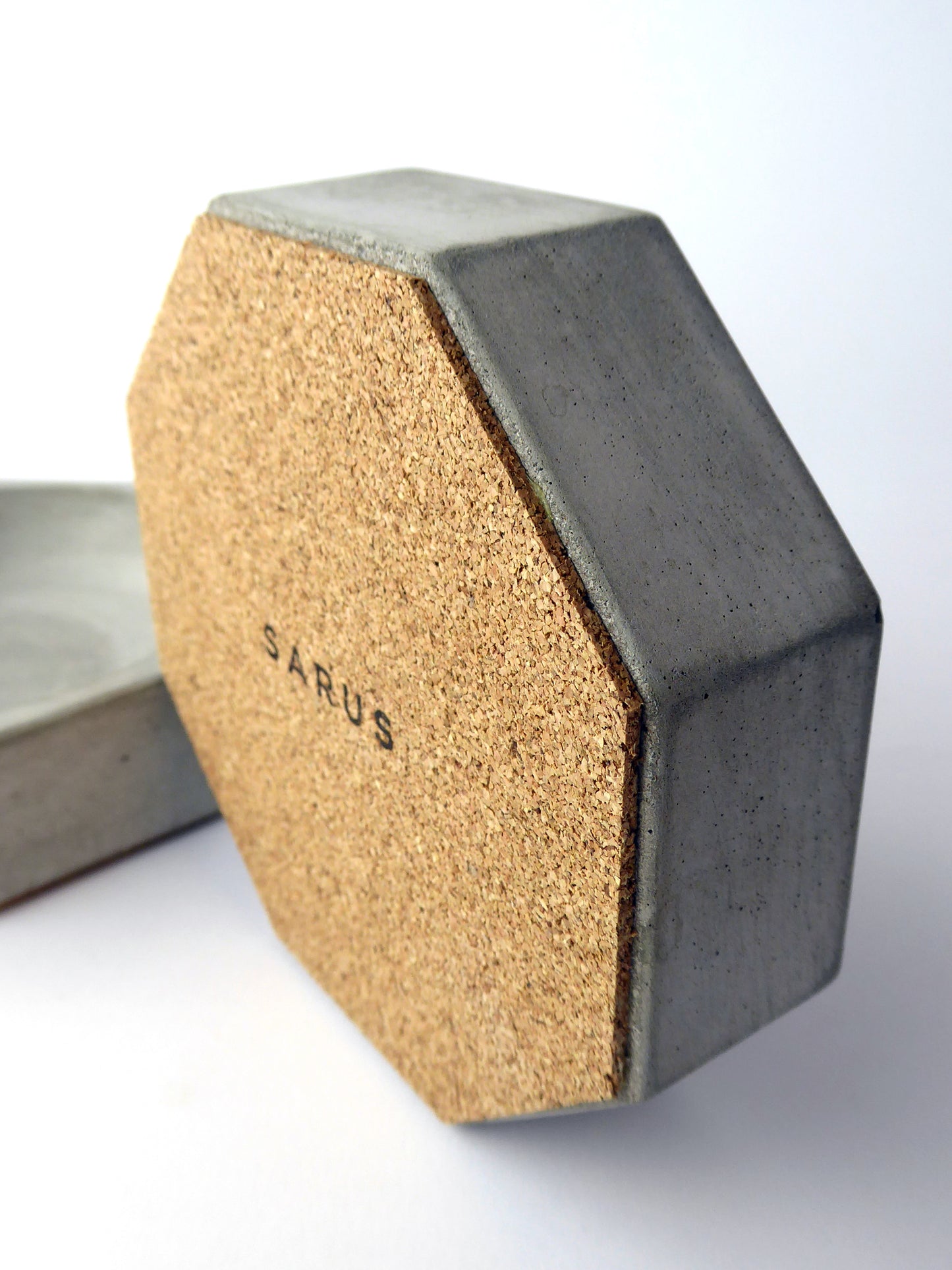 Grey concrete dish with a cork base