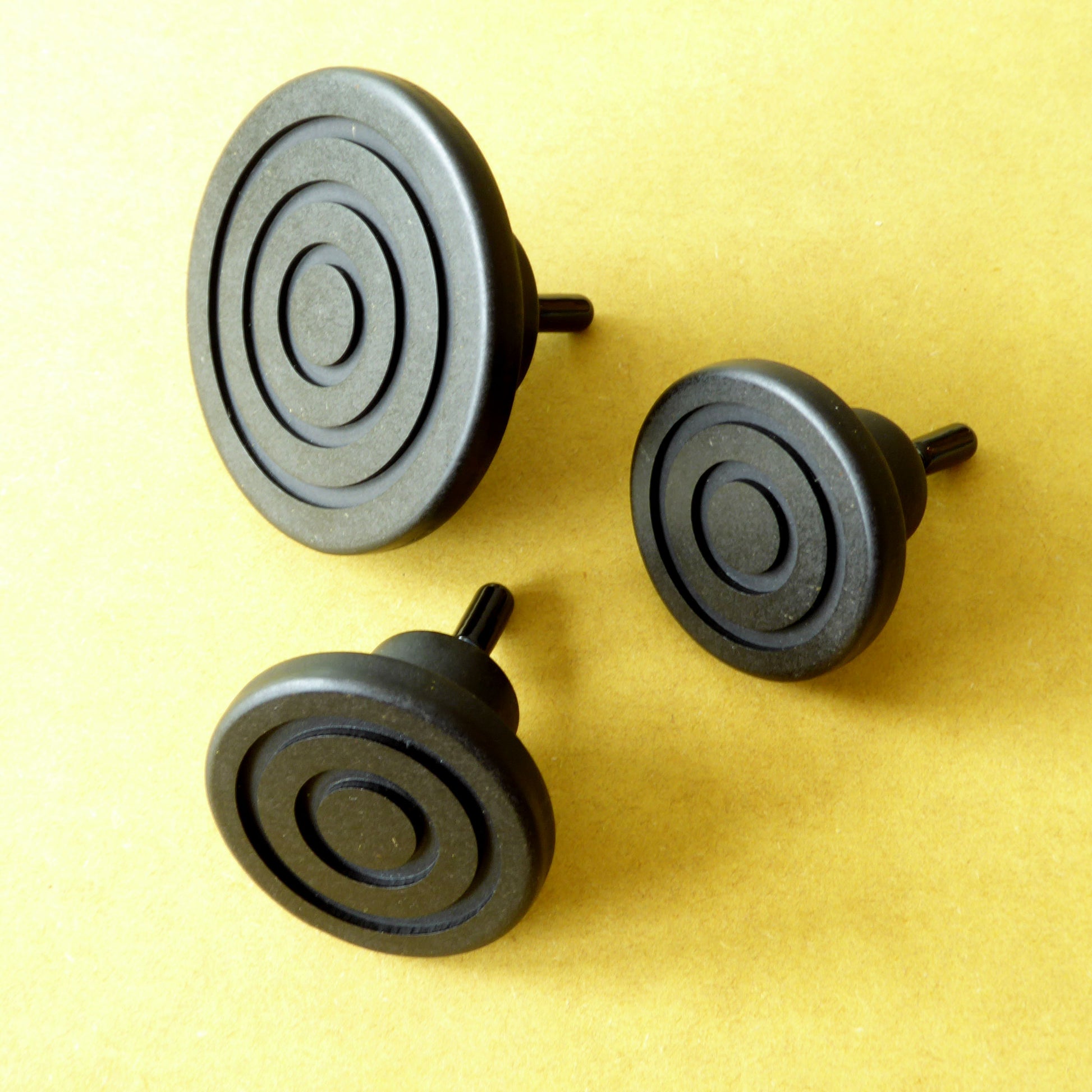 Trio of handcrafted minimalist clothes hooks in 3 different sizes
