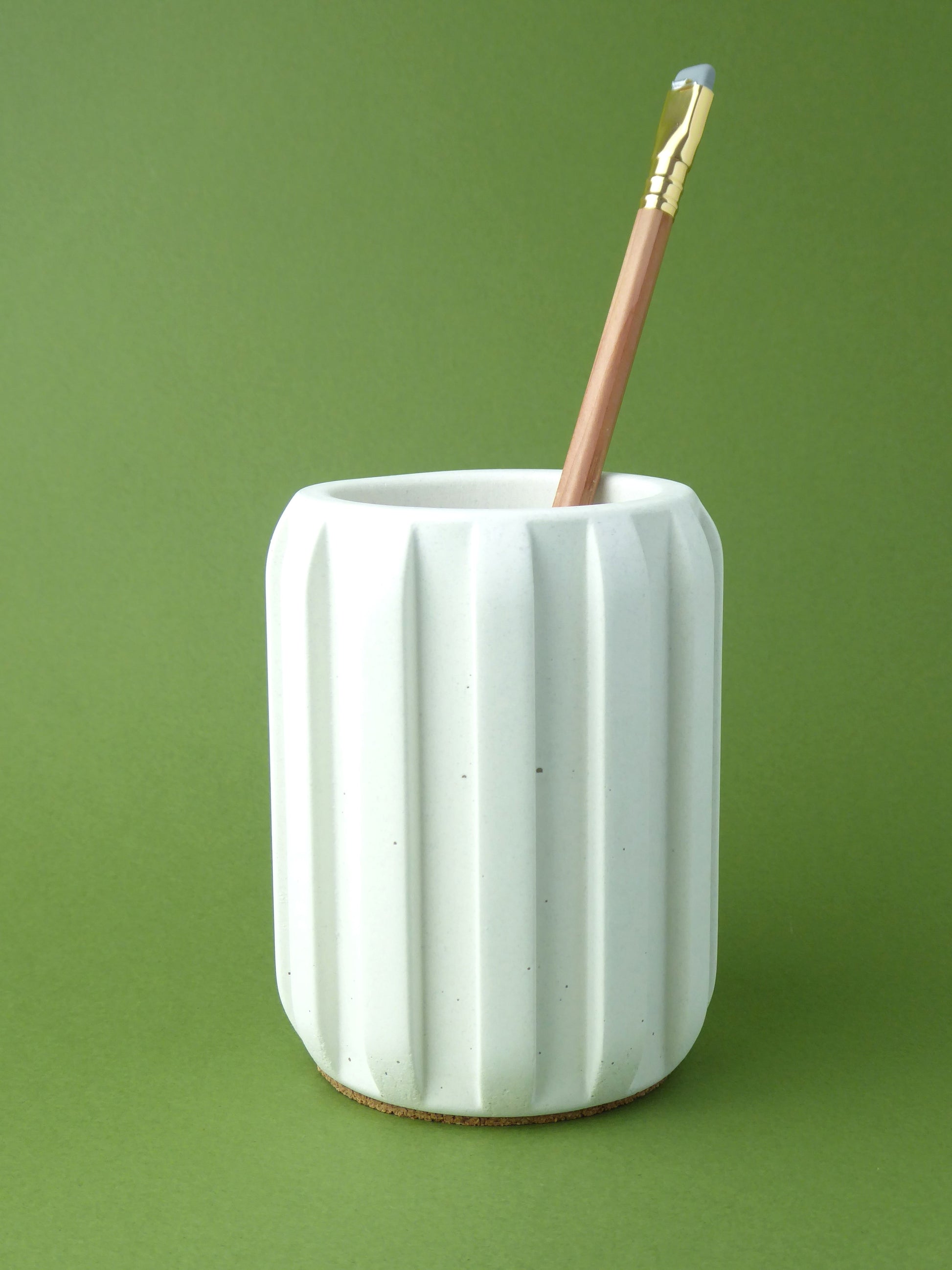 White pen holder with a textured surface