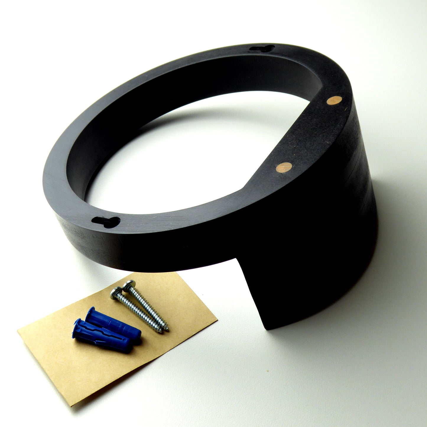 Wooden display shelf with the screws and wall plugs needed to mount it