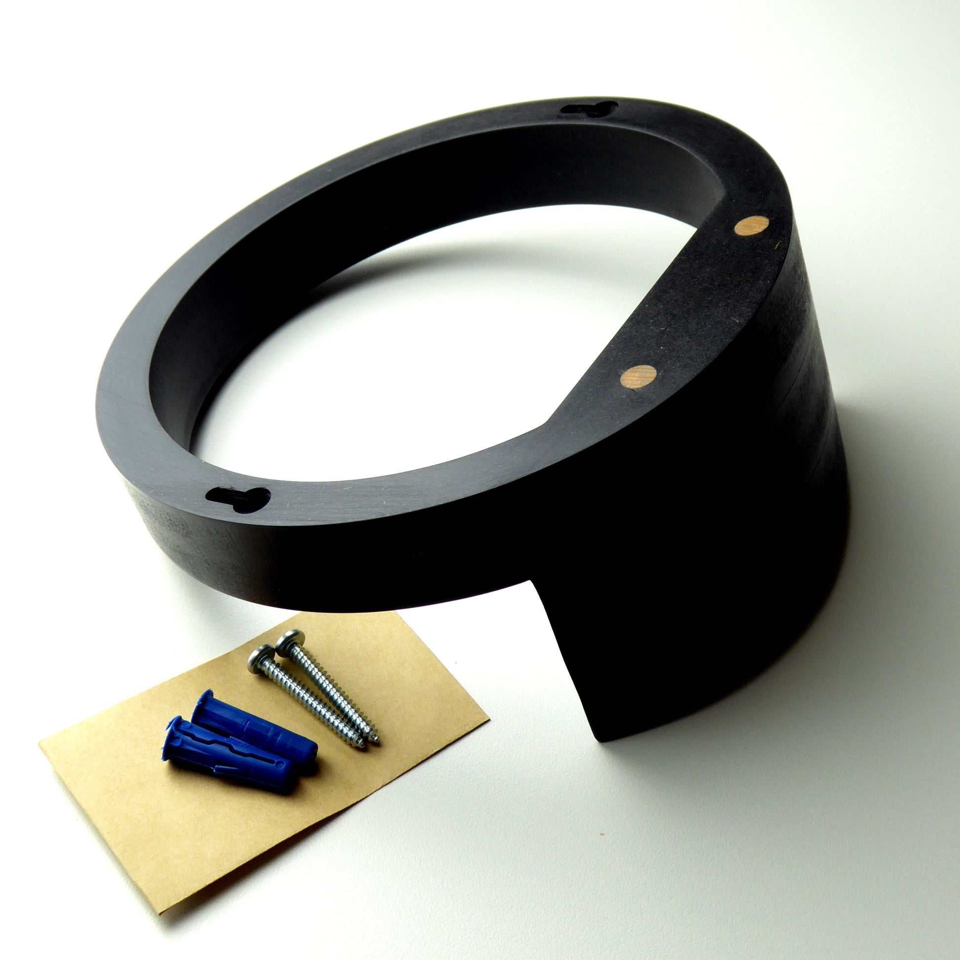 Wooden display shelf with the screws and wall plugs needed to mount it