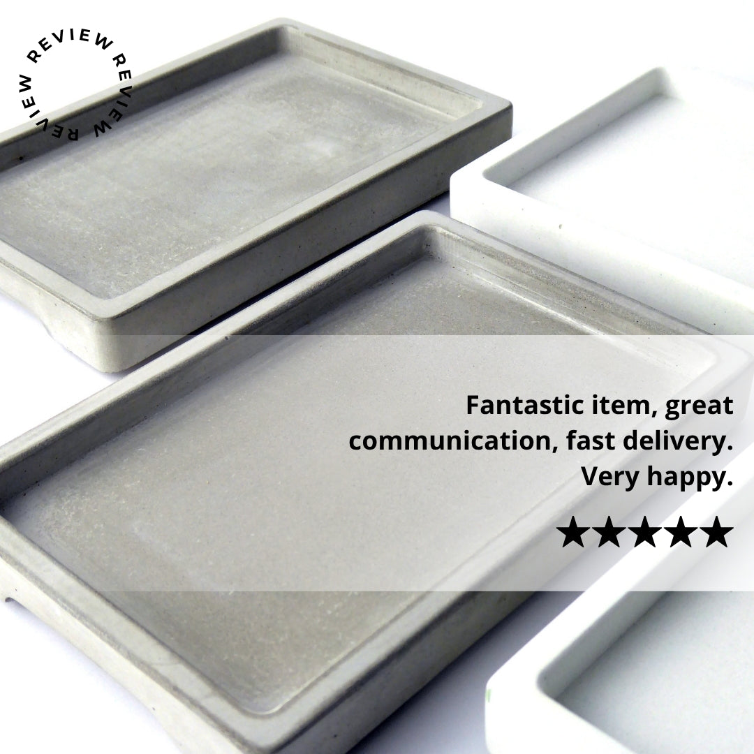 Concrete trays in white and grey with a review and a five-star rating.