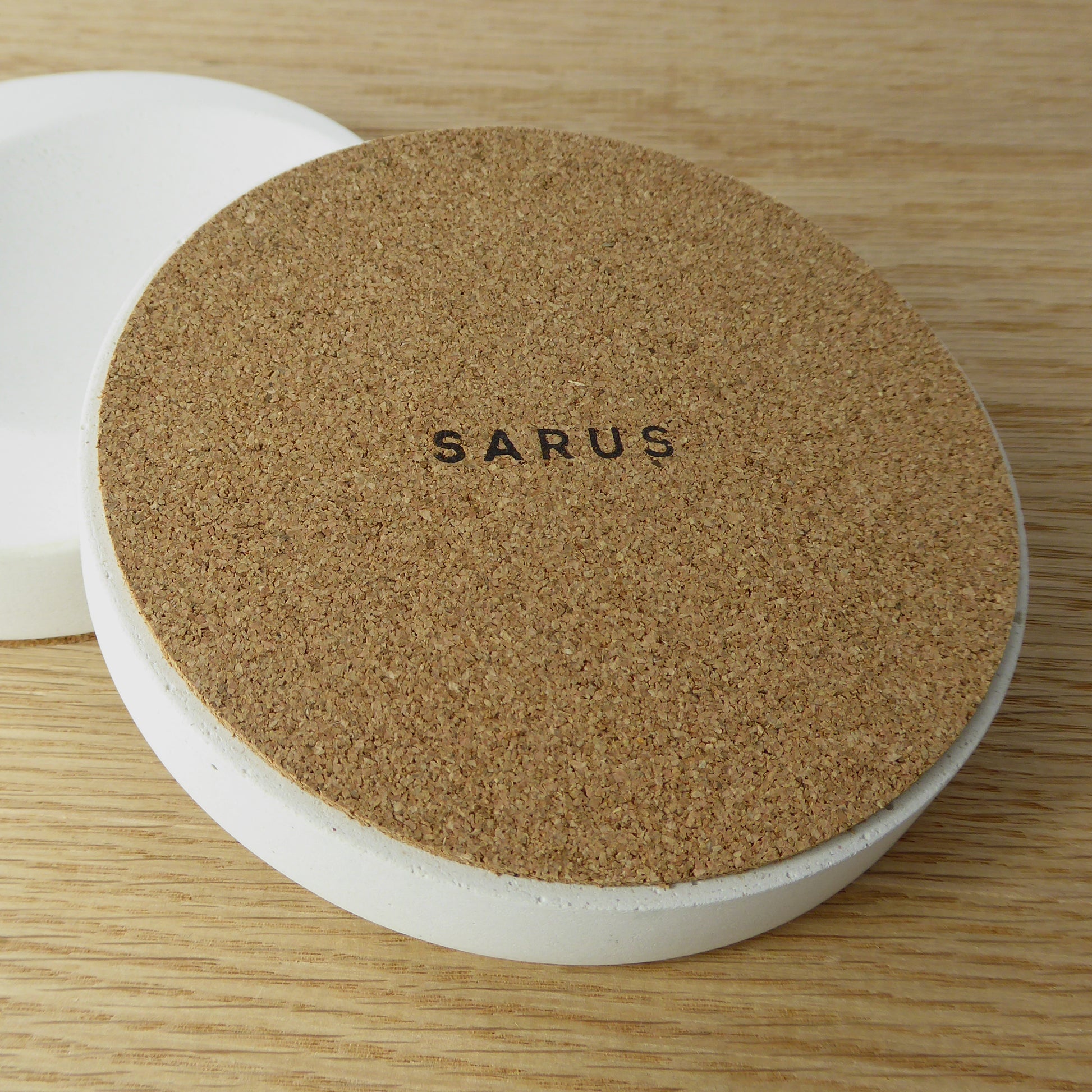 Round white trinket tray with a cork base