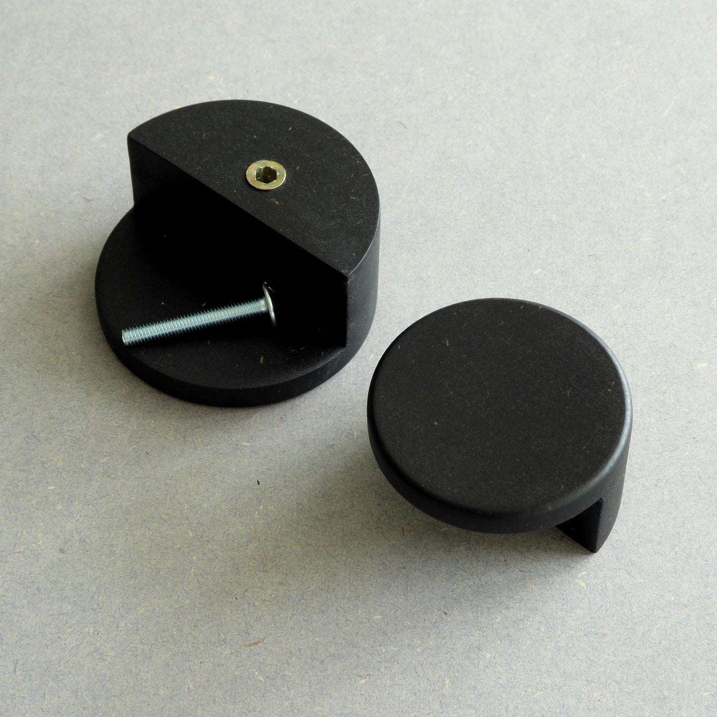 Black wooden cupboard door handle with a fixing screw for easy installation