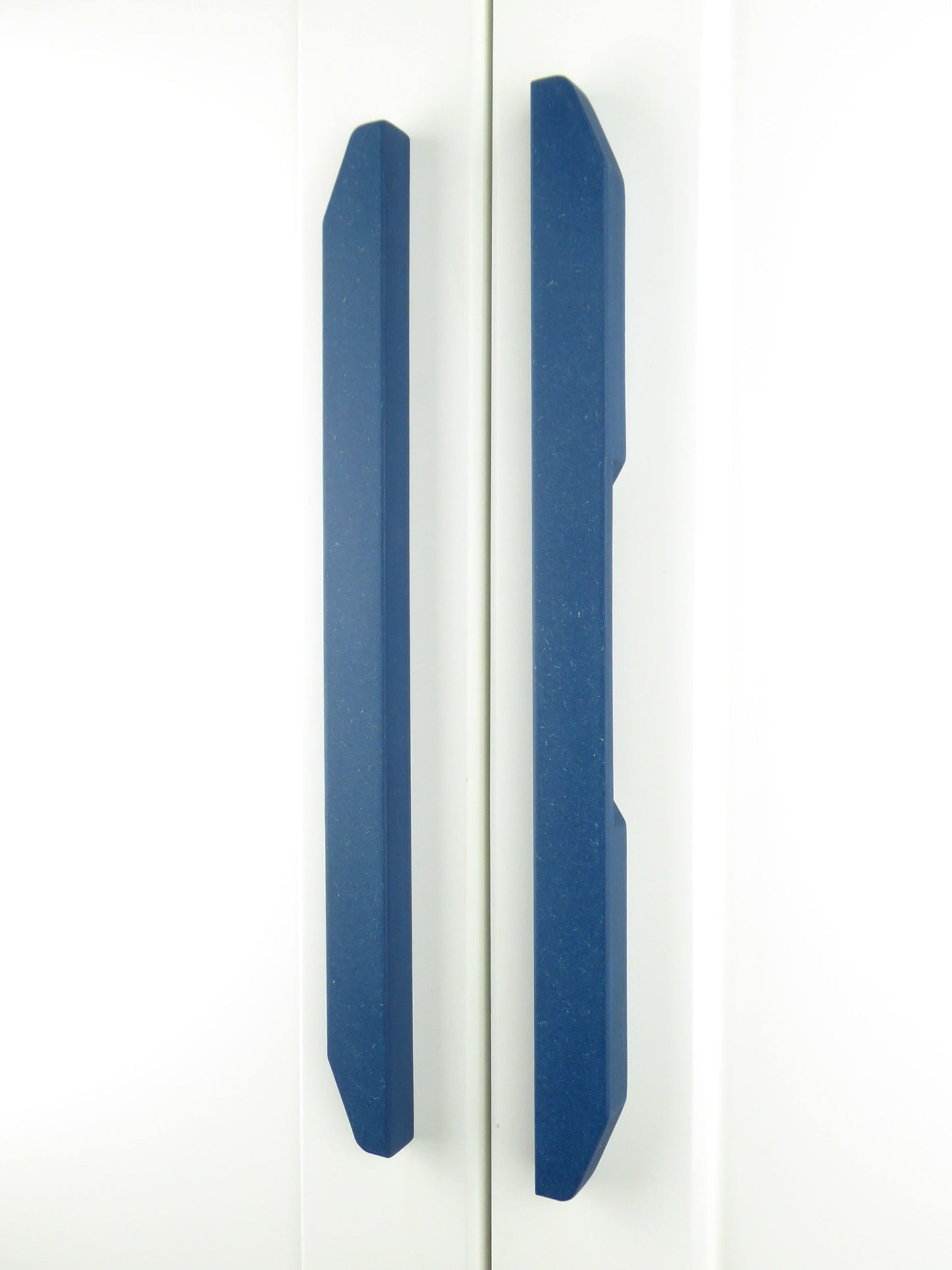 A pair of handcrafted tapered blue handles for upcycling furniture