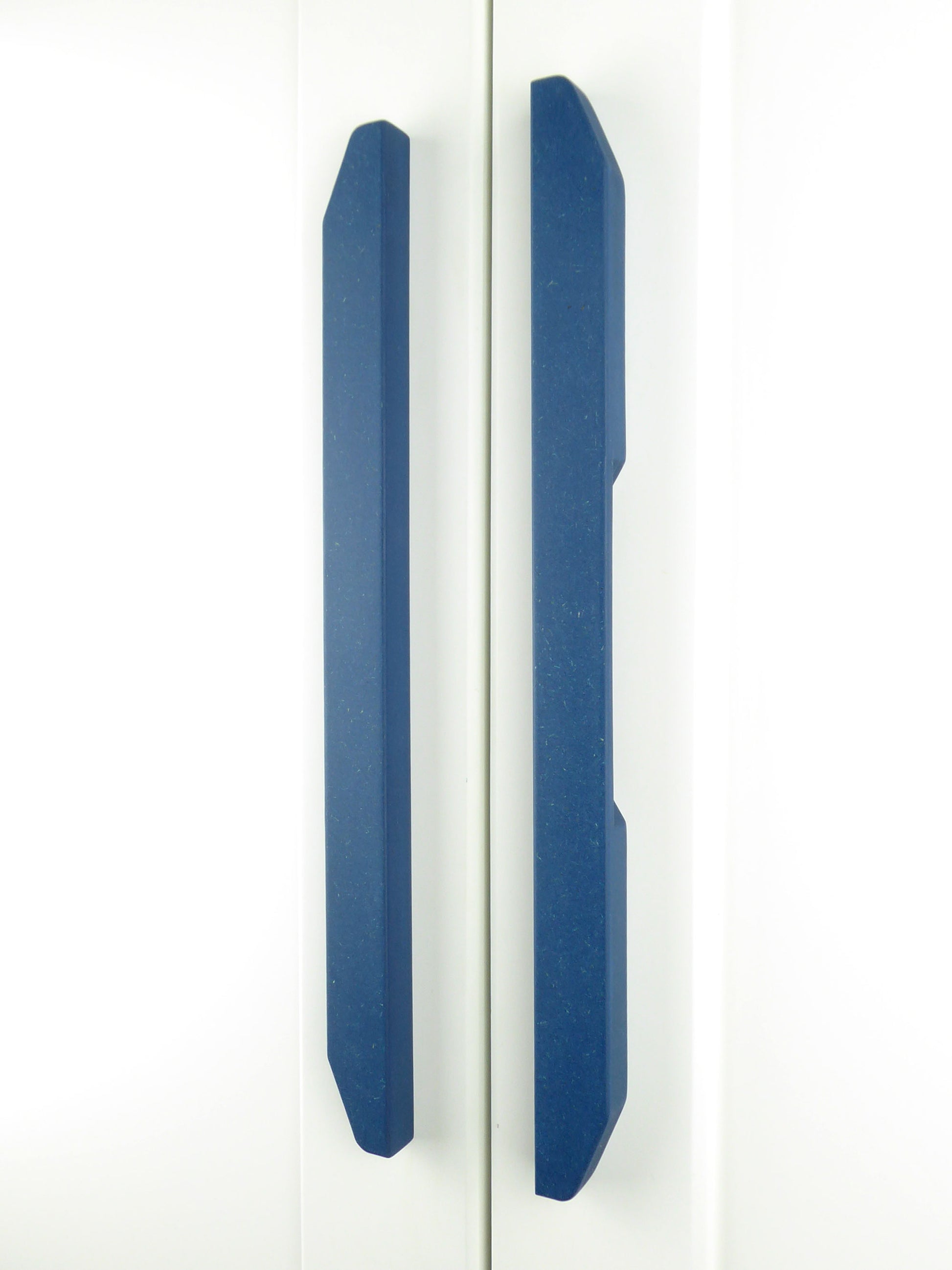 A pair of handcrafted tapered blue handles for upcycling furniture