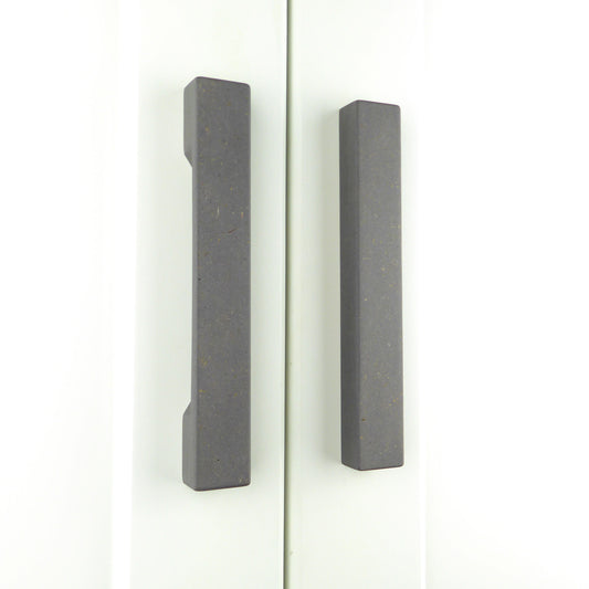 Two slimline wooden wardrobe handles in grey colour, mounted vertically on a white wardrobe.