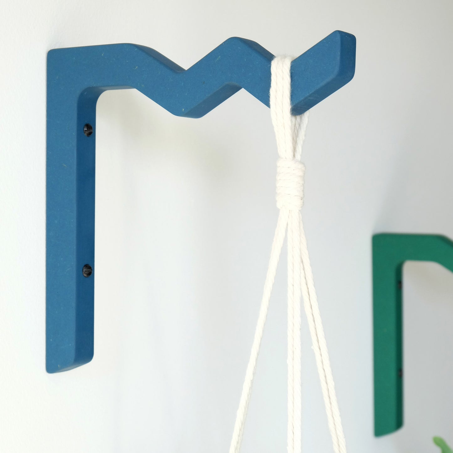 Blue wooden wall mounted bracket for a macrame plant hanger