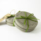 Set of 2 grey concrete coasters embossed with Hove Actually 