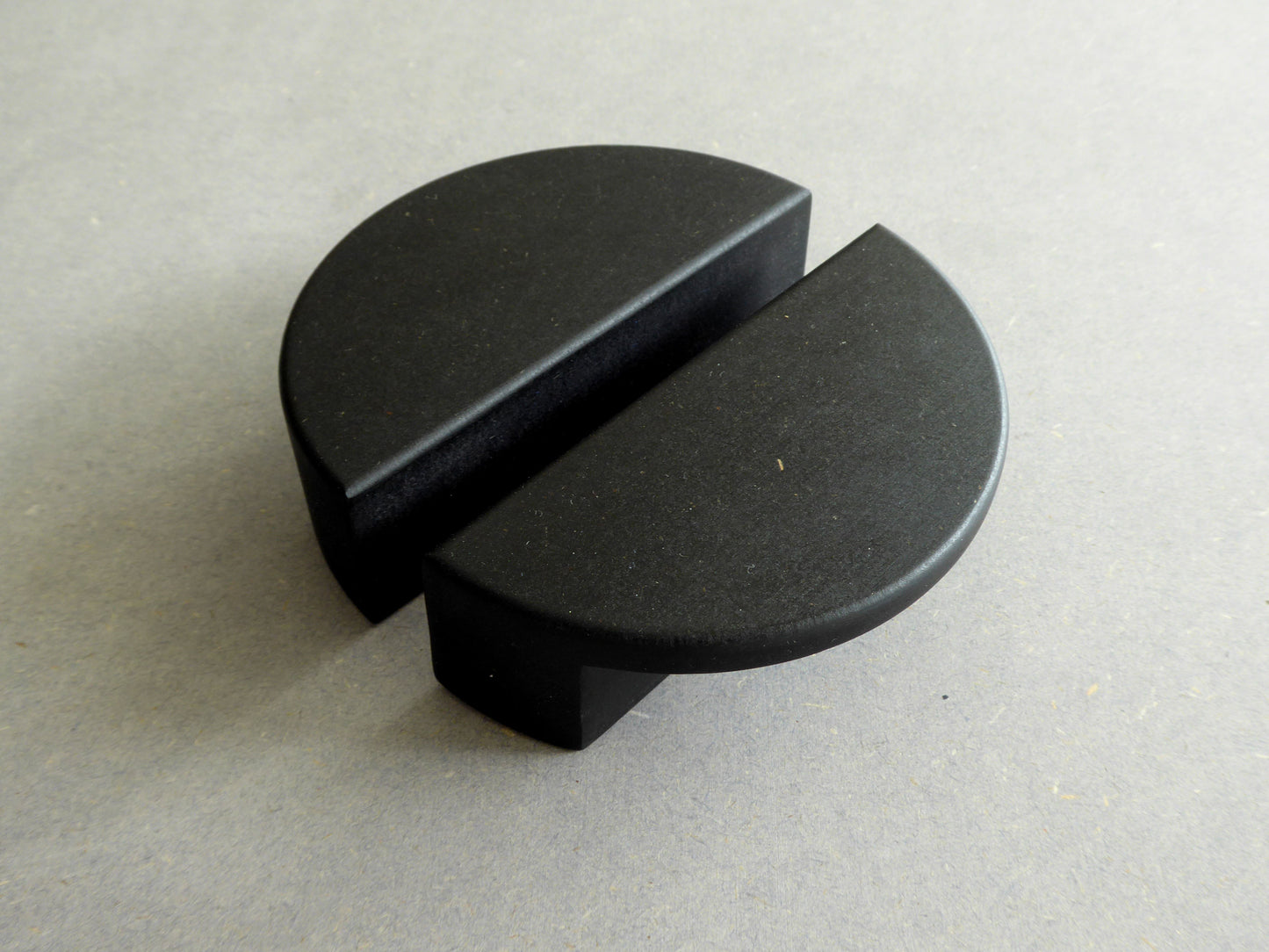 modern cabinet handles made from black wood