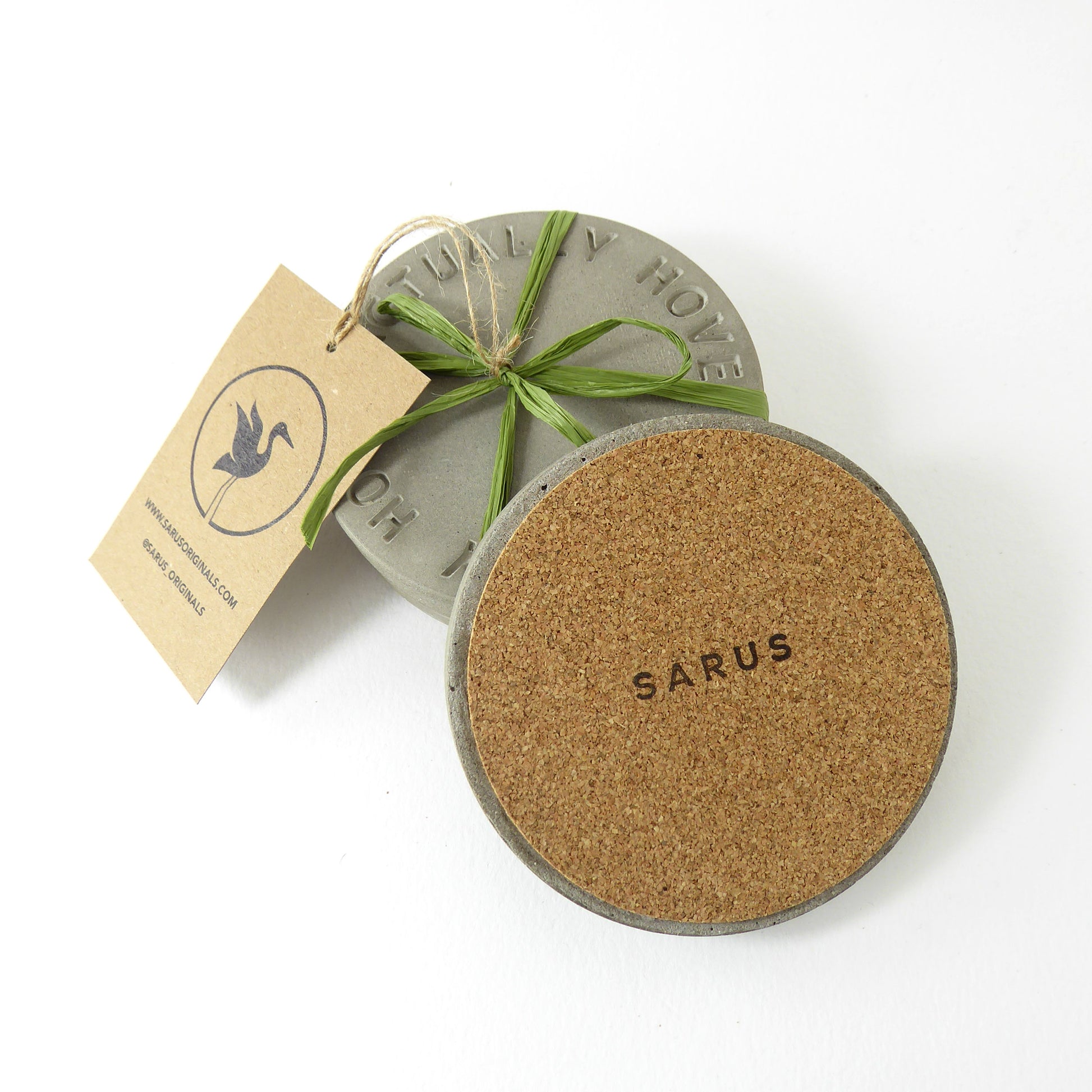Two round coasters, one showing the cork base to protect surfaces