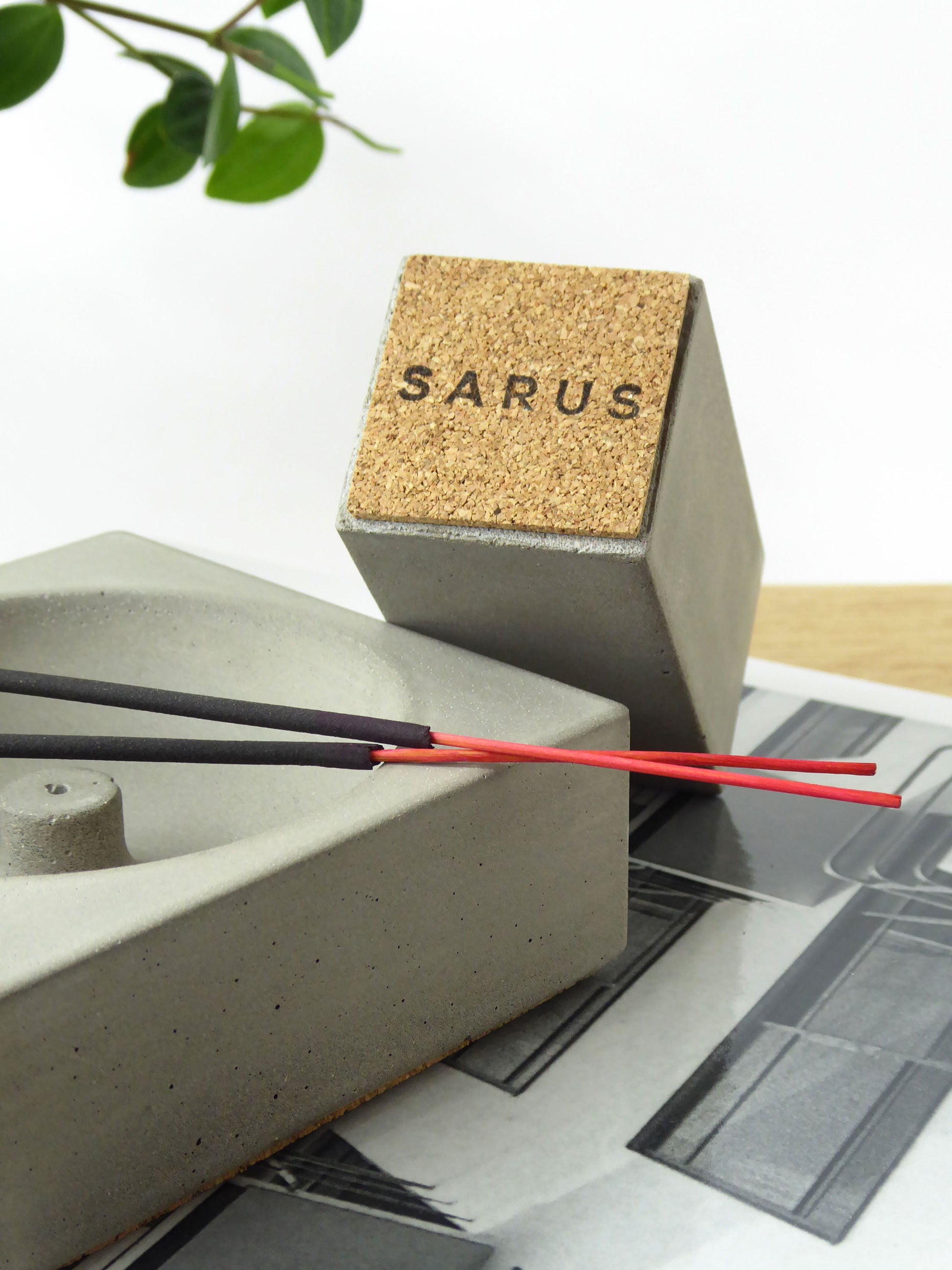 Concrete incense stick pot base showing the cork on the base